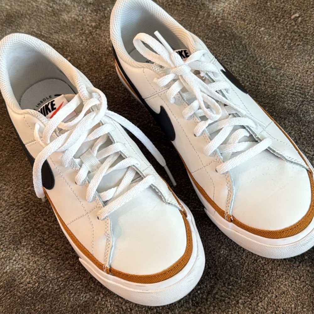 Nike boys sneakers- fits a Womens’s size 7